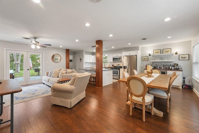 dining space with ceiling fan, dark wood-type flooring, and french doors