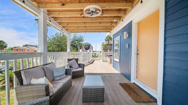 wooden terrace featuring an outdoor living space