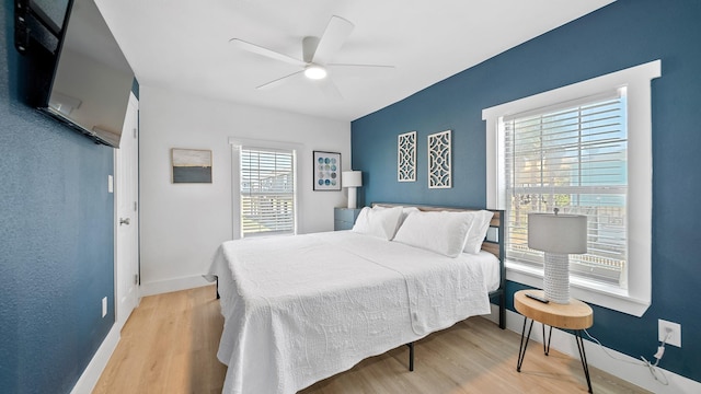 bedroom featuring ceiling fan and light hardwood / wood-style flooring