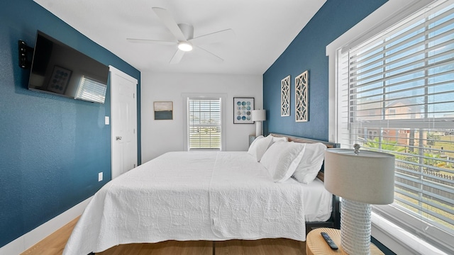 bedroom featuring ceiling fan and wood-type flooring