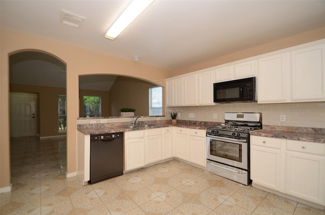 kitchen featuring sink, white cabinetry, tasteful backsplash, and black appliances