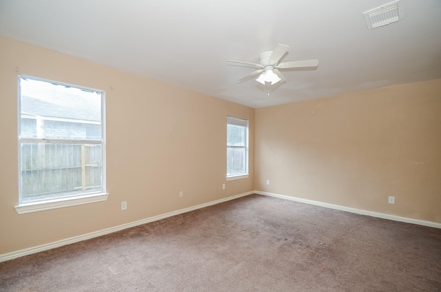 unfurnished room with ceiling fan and carpet flooring