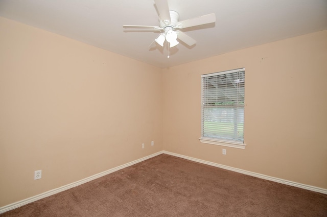 carpeted empty room featuring ceiling fan