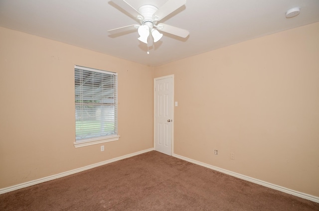 carpeted empty room featuring ceiling fan