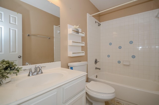 full bathroom featuring toilet, vanity, and tiled shower / bath