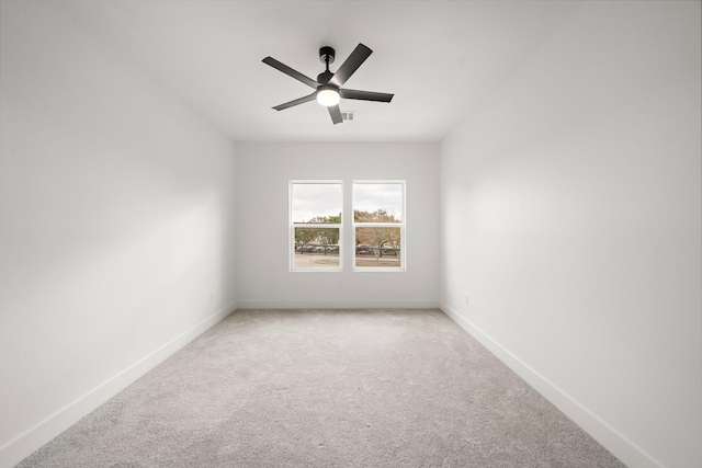 unfurnished room with ceiling fan and carpet flooring