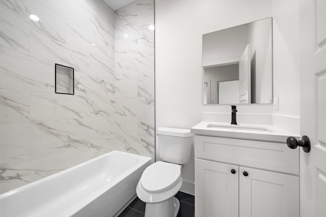 full bathroom with toilet, vanity, tile patterned floors, and tiled shower / bath combo