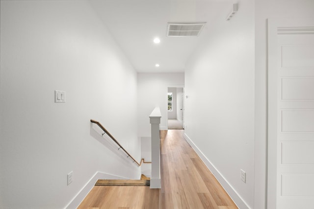 corridor with light wood-type flooring