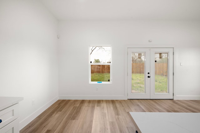 doorway featuring light hardwood / wood-style floors and french doors