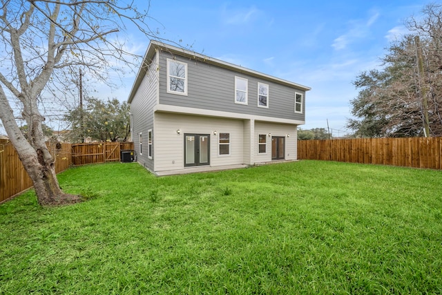 rear view of house with a yard