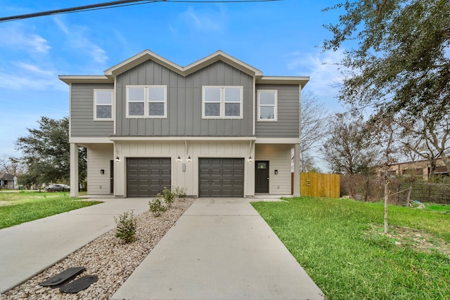 view of front facade with a front yard and a garage