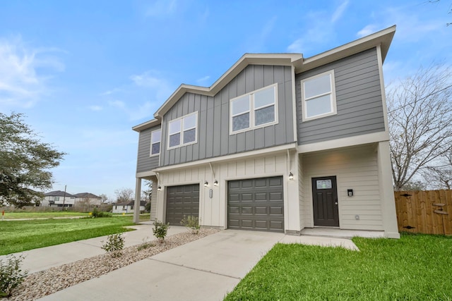 view of front of house with a front lawn and a garage