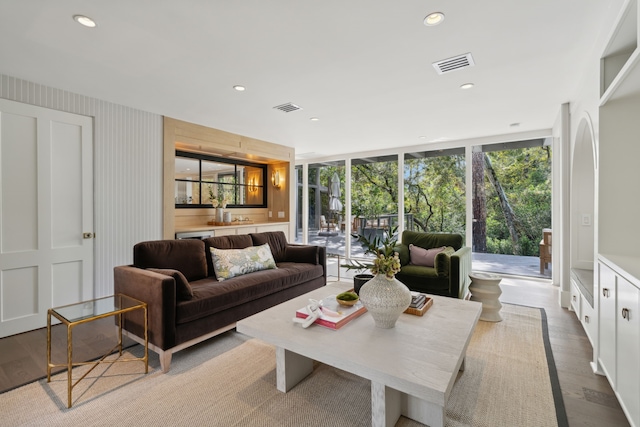 living room featuring light hardwood / wood-style floors and floor to ceiling windows