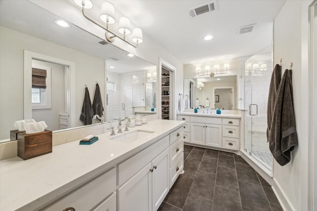 bathroom featuring vanity, walk in shower, and tile patterned floors