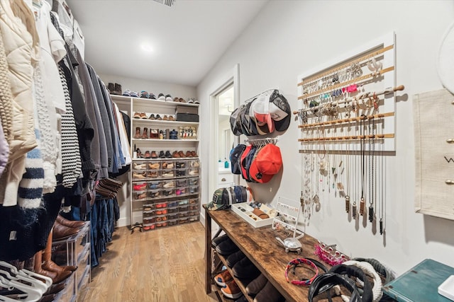 spacious closet with light hardwood / wood-style floors