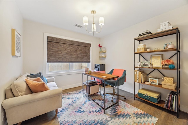 office featuring hardwood / wood-style floors and a chandelier