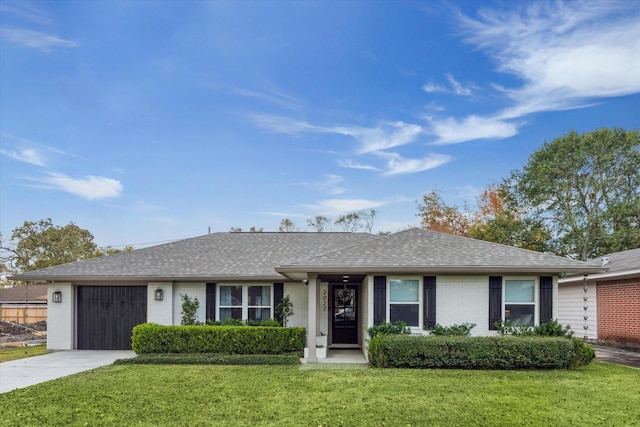 single story home featuring a front yard and a garage