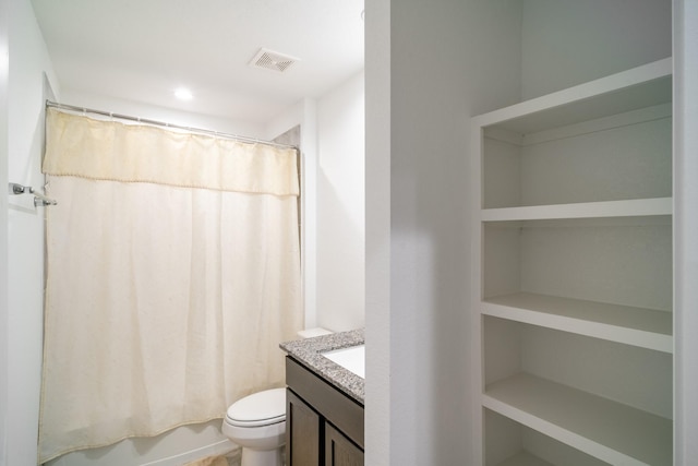 full bathroom with shower / bath combo with shower curtain, vanity, and toilet