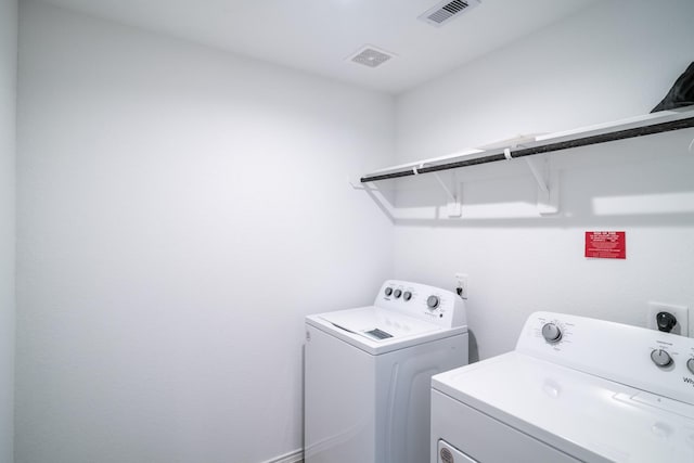 laundry area with washer and clothes dryer