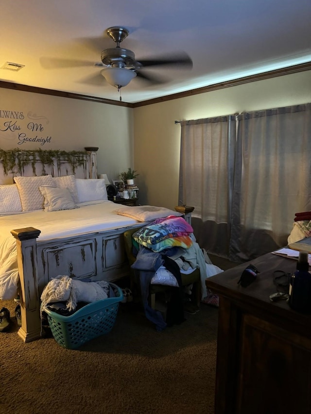 bedroom with ceiling fan, carpet, and crown molding