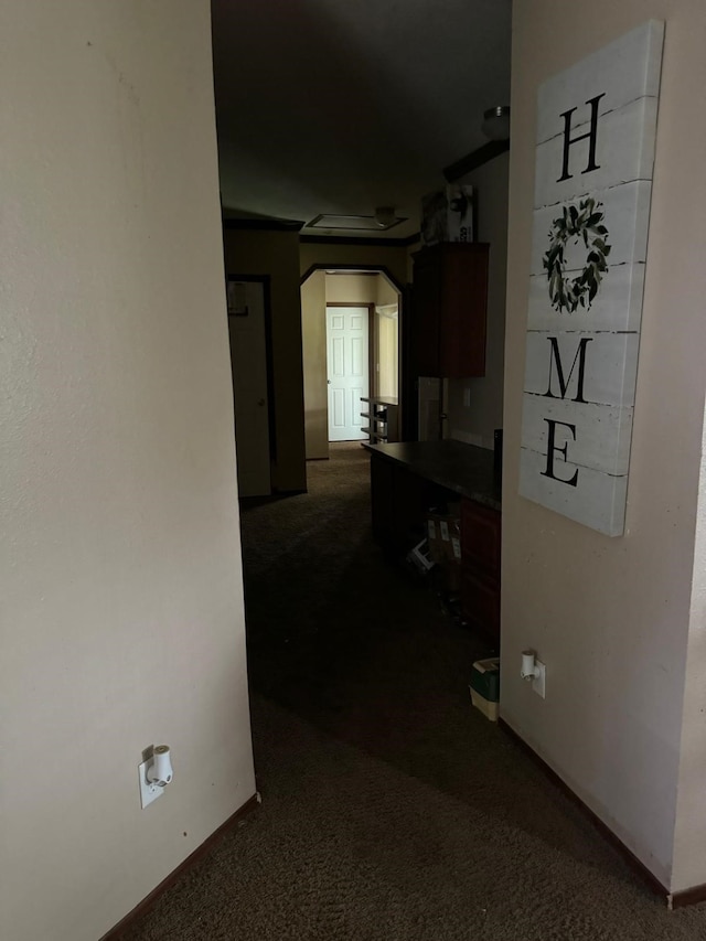 hallway with dark carpet