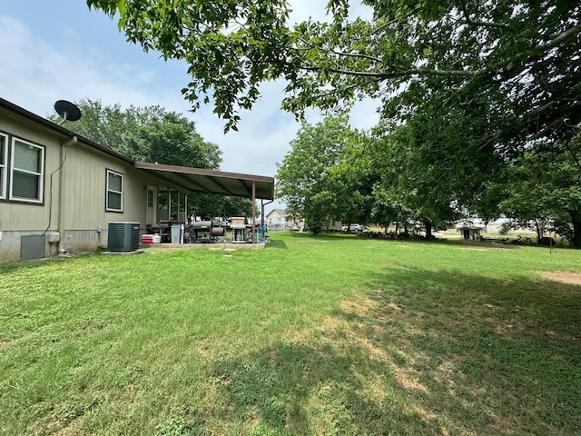 view of yard featuring cooling unit and a patio area