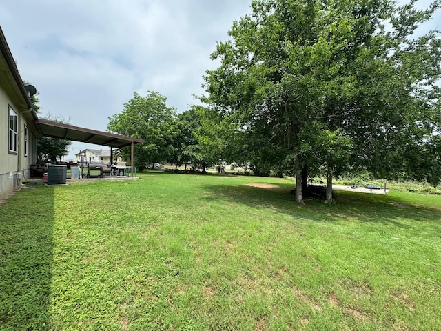 view of yard featuring central AC