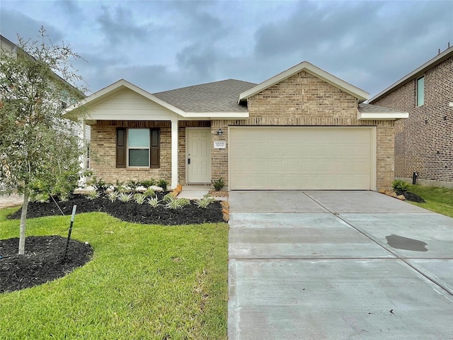 ranch-style house featuring a garage and a front lawn