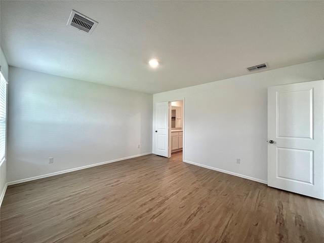 unfurnished room featuring dark hardwood / wood-style floors