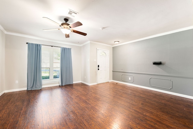 empty room featuring ceiling fan, ornamental molding, and dark hardwood / wood-style floors