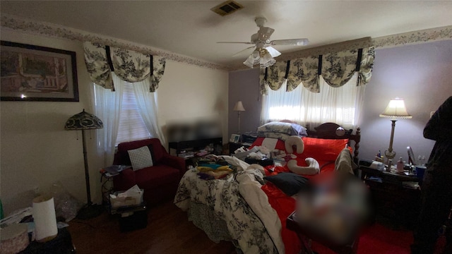 bedroom featuring ceiling fan and hardwood / wood-style flooring