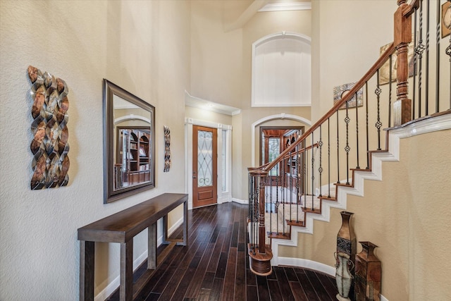 entryway with a towering ceiling