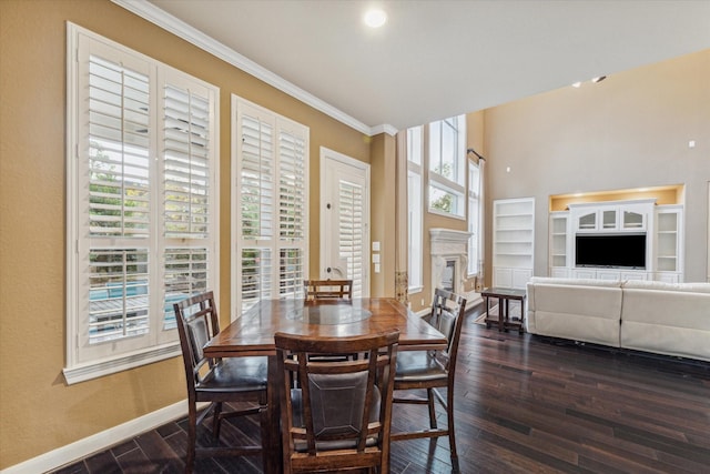 dining space featuring dark hardwood / wood-style flooring and crown molding