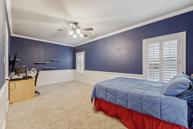 bedroom with ornamental molding, light colored carpet, ceiling fan, and multiple windows