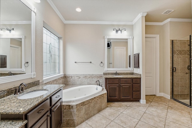 bathroom featuring plus walk in shower, vanity, crown molding, and tile patterned floors