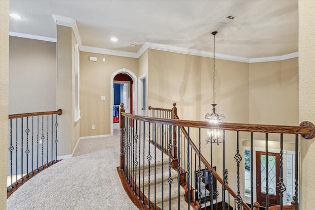 corridor with carpet floors and crown molding