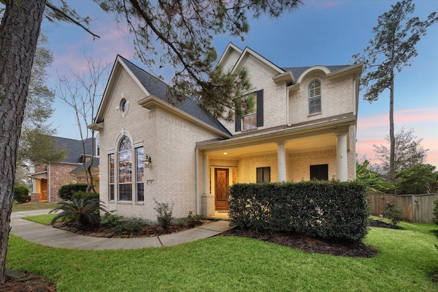 view of front of property with a yard