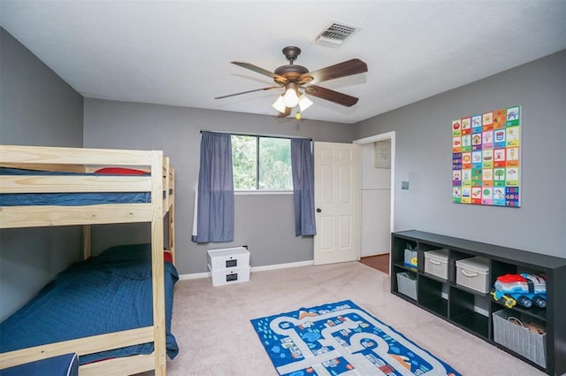 carpeted bedroom with ceiling fan