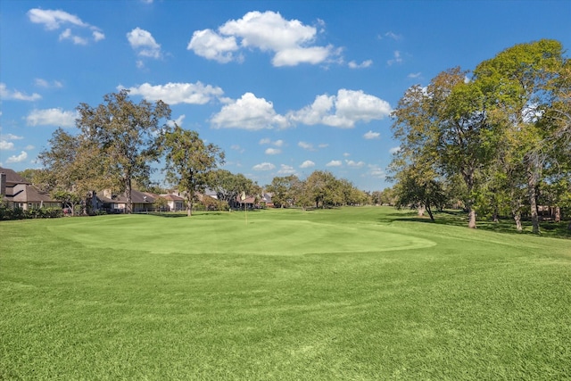 surrounding community featuring a yard