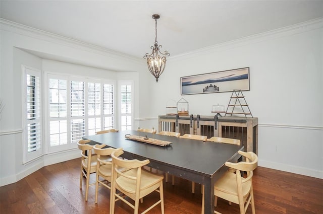 dining room featuring ornamental molding, dark hardwood / wood-style flooring, and a wealth of natural light