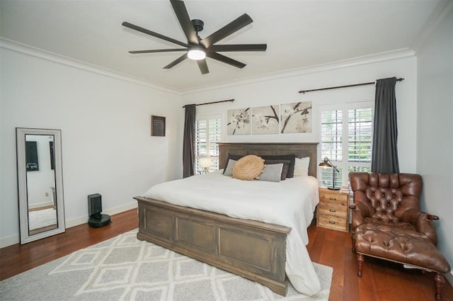 bedroom featuring ceiling fan, crown molding, and dark hardwood / wood-style flooring