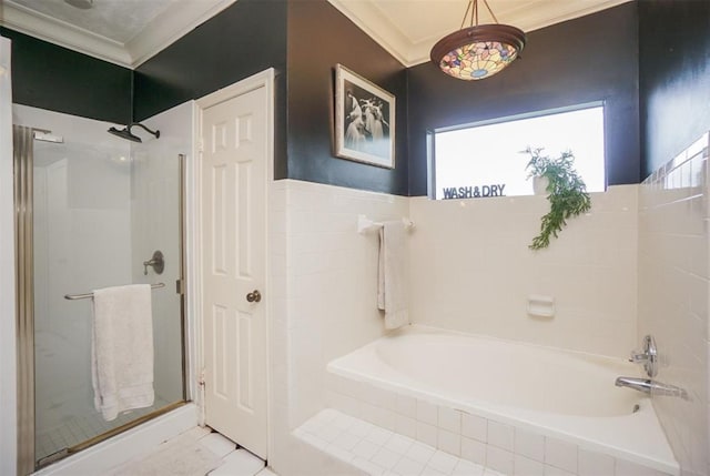 bathroom with shower with separate bathtub and ornamental molding