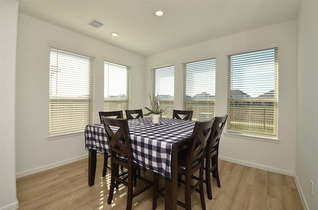 dining space featuring light hardwood / wood-style flooring