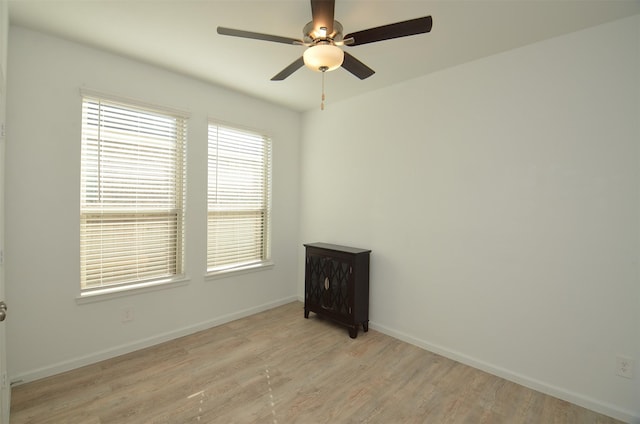 unfurnished room featuring light hardwood / wood-style floors and ceiling fan