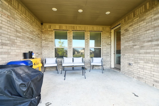 view of patio / terrace featuring an outdoor living space and a grill