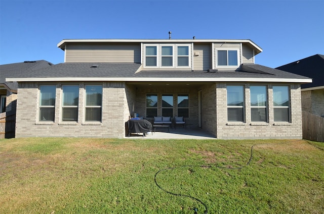 back of house featuring a yard and a patio area