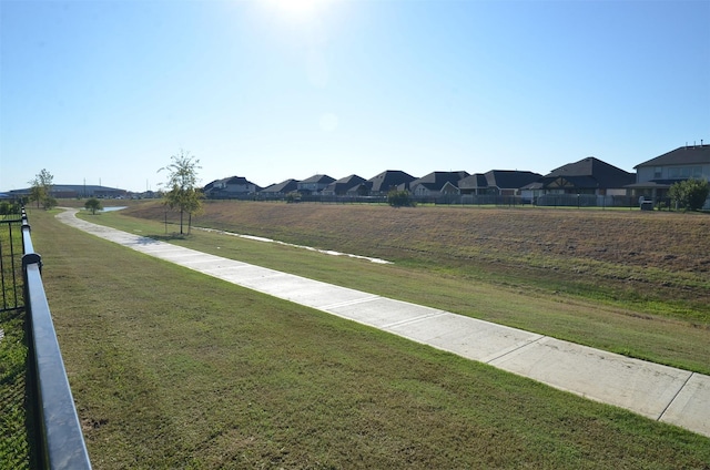 view of home's community featuring a yard