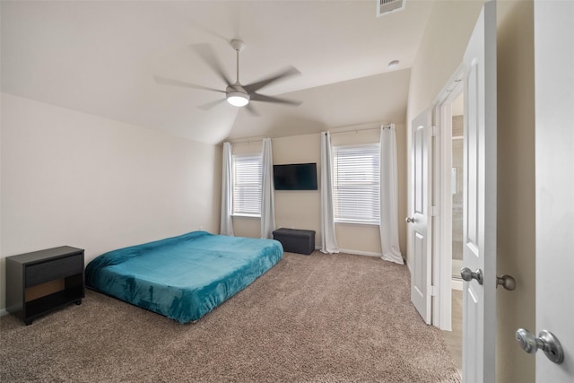 bedroom featuring ceiling fan, carpet flooring, and lofted ceiling