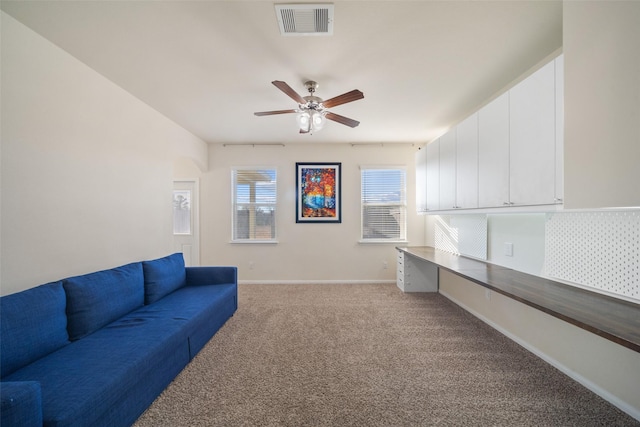 living room featuring light carpet and ceiling fan