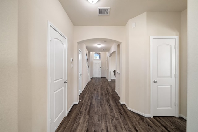 corridor with dark hardwood / wood-style floors